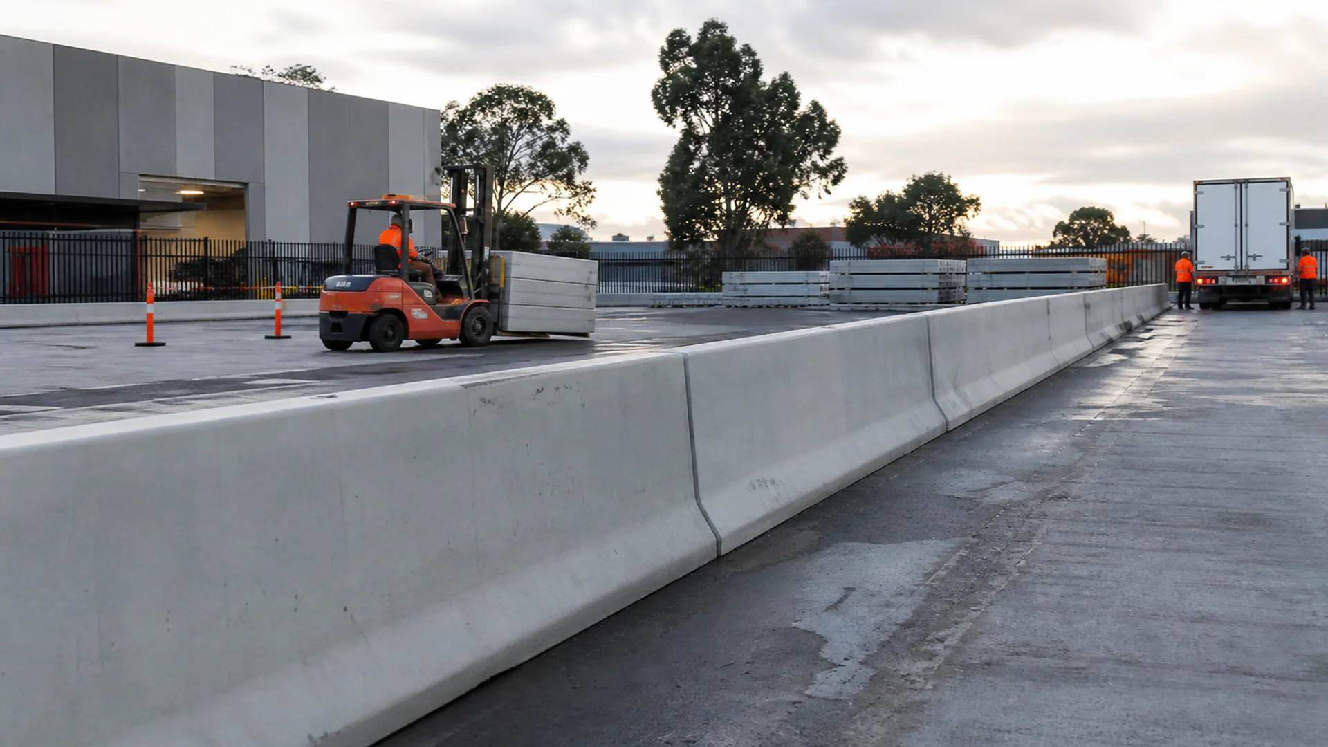 Precast concrete barriers defining a commercial access area